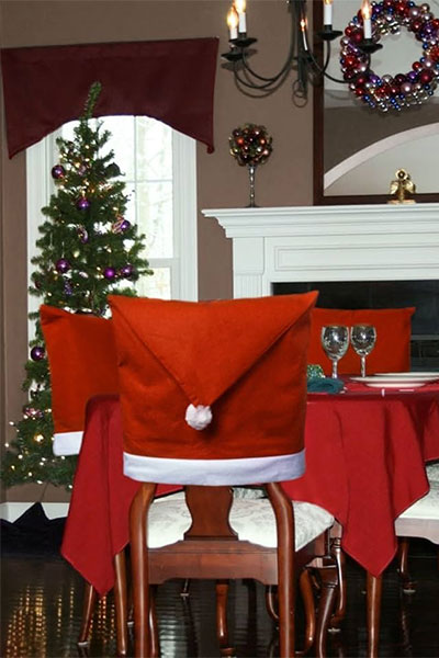 Santa hats on dining chairs