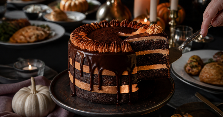 These 12 Halloween Desserts Get Cut Before Dinner Starts 28 Triple-layer dark chocolate Halloween drip cake with orange frosting being sliced